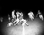 Texas Christian University (TCU)-Marquette Football Action. Marvin Lasater being tackled by Frank Reginelli by Harry Cabluck Jr.