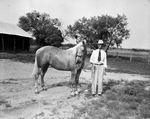 Henry C. Wilson with Palomino Quarter horse by Bill Durham