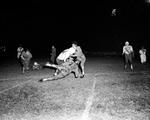 Paschal-Poly football game. Bobby Dobbs with ball being tackled by Pat Wadlington and Robert Wilson by Al Panzera