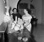 Mrs. Clifford Craig Poindester and Mrs. Daniel C. Hamilton at the Junior Woman's Club Guest Coffee and Bazar