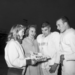 Breckenridge team gets ready. Cheerleaders Ida Joe Waller and Gracie Brown chat with Dickie Rogers and Jimmo Wilson