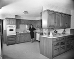 Mrs. W. W. Martin Shown in the Kitchen of Her New Home by Wilburn Davis