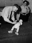 Police man Joe Fergusan with infant