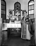 Reverend Anastasios Vlamides at alter at St. Demetrios Greek Orthodox Church