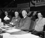 Amon Carter and General Dwight Eisenhower with 2 unidentified men seated on spekers platform at the Baptist General Convention in Will Rogers Coliseum