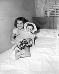 Beverly Gale Nave in bed with doll