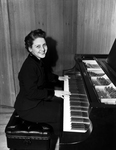 Virginia Thomas seated at piano