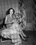 Mrs. C. S. Ivey sewing in her home