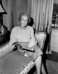 Mrs. C. D. Reimers seated on couch