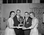 Star-Telegram Home Show booth winners: Fakes & Co. booth, Edith Flo, Herman Dale, and Vera Hicks receiving award from Chester, Haltom