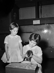 Children's Museum. Janice and Karon Wright with 3 month old mink