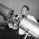 Lewis Heath checks telescope at Fort Worth Children's Museum