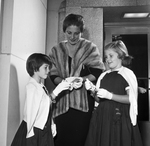 Mrs. G. P. Courtney, Jr. with daughters Cynthia and Caren attending "La Boheme"