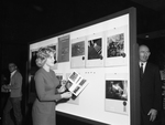 Mrs. Tommy E. Terrill Jr. with Photo Display