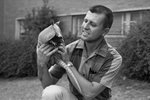 William J. Voss with armadillo at the Fort Worth Children's Museum