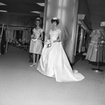 Bride Section; Genevieve Haygood in formal wedding gown with Gunilla Hutton-Miller in golden topaz dress