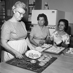 Mrs. O. J. Urbanovsky, with Mrs. Albert G. Young and Mrs. Carl Jettun