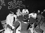 Teen Clubs; teens sitting with cokes by Bob Draddy