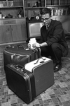 Reporter Bill Hendricks, packing for Vietnam by George Smith