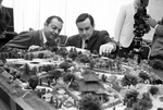 Tom J. Vandergriff and Mike Jenkins examine model of Seven Seas theme park by Dale Blackwell