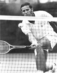 Roy Emerson returns volley in winning match against Pancho Gonzales at Colonial Country Club's National Invitational tennis tournament