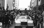 Clint Murchison Jr. greets crowd standing in car during homecoming ticker-tape parade for Dallas Cowboys following defeat by Baltimore in Miami Super Bowl by Al Panzera