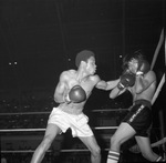 Wilburn Lawson boxes against Armando Reyes during Golden Gloves regional matches at Will Rogers Coliseum by Al Panzera