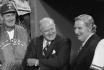 Bob Short, Texas Ranger owner (right), with manager Ted Williams (left), and American League President Joe Cronin (center)