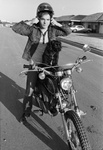 Jerry Dean Martin prepares to take his dog "Puppie" for a ride on his motobike