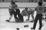 Ron Kennedy is restrained by referee during Fort Worth Wings hockey game
