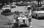 Young entrepreneurs set up lemonade stand