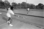 Willie Rowlins and Charles Reavis practice for Sycamore Tennis Invitational in conjunction with Juneteenth activities