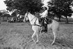 William Brown with his horse Snow White in Juneteenth celebration at Stop Six Corral by Ron McKeown