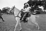 William Brown with his horse Snow White in Juneteenth celebration at Stop Six Corral by Ron McKeown