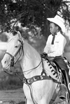 William Brown with his horse Snow White in Juneteenth celebration at Stop Six Corral by Ron McKeown