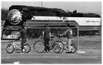 Curtis and Karen Giles and Robert Griffith (center) look at a real steam engine
