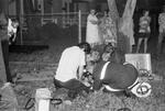 Fort Worth firemen work with Reggie Anderson (age 6) who was removed unconscious from burning home by Larry Roquemore