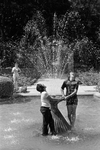 Arturo Veliz and Albert Carrizales in Fort Worth Botanic Garden fountain by Gene Gordon