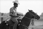 Rider on horseback practicing for Juneteenth festival's rodeo and parade