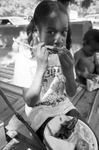 Children enjoy food served at Sycamore Park during Juneteenth festivities
