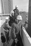 On top of new Fort Worth City Club, foreground, Jenkins Garrett, Robert W. Decker, Charles Ringler, and foreman Lamar Smith