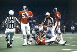 Dallas Cowboys vs. Denver Broncos at Super Bowl XII in New Orleans, Cowboys players DuPree and Staubach with and Broncos player Jackson by Ron Heflin