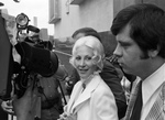 Priscilla Davis is surrounded by reporters by Ron Heflin