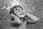 Water fun during heat wave by Larry C. Price