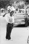 Teenager attending Juneteenth festivities in Sycamore Park by Norm Tindell