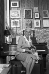 Betsy Colquitt with dog on her lap, Texas Christian University (T. C. U.) professor and poet relaxes at her home near Texas Christian University (T. C. U.)