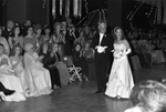 The Assembly Ball, Ridglea Country Club; James M. Harrison escorts his daughter Marsha Wynne Harrison past friends and family. by Rodger Mallison
