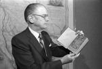 Jenkins Garrett holding book