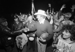 Chuck Curtis shaking hands following win over Brownwood at Texas Christian University (T. C. U.) Amon Carter Stadium by John Costello