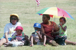Mary Lane, Jeremy Hall, and Charity Lemma with others during Juneteenth festivities at Hillside Park by Eric Williams